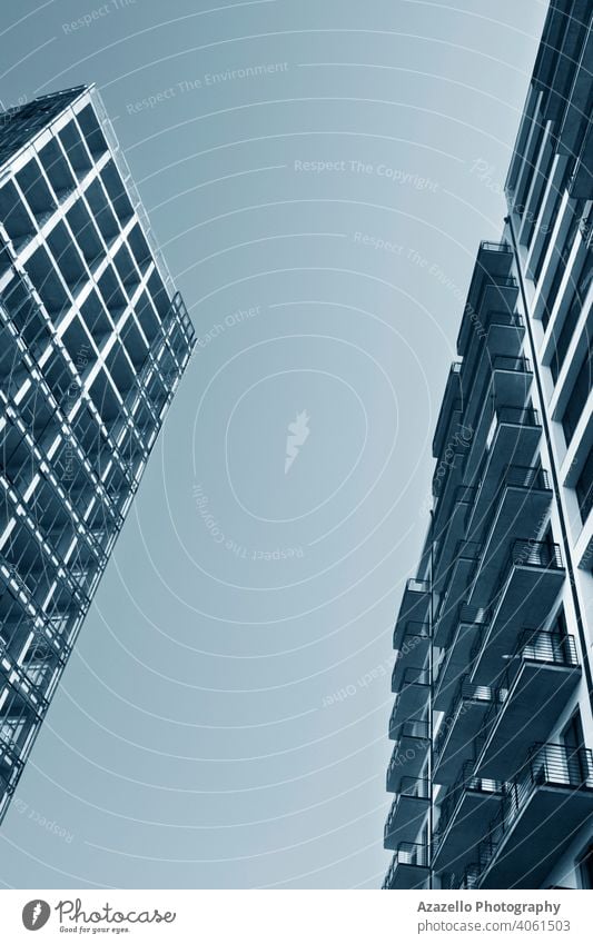 Two multistory buildings standing face to face. abstract apartment architecture background balconies blue business casino city cityscape condominiums