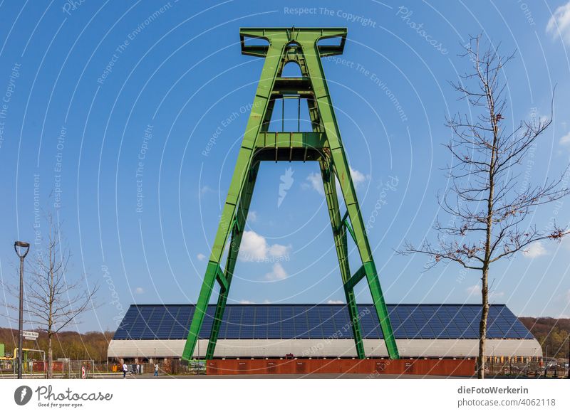 green winding tower in front of a blue sky Architecture Mine tower Tower unsaturated Gray Industry The Ruhr Mining Exterior shot Colour photo Sky Deserted