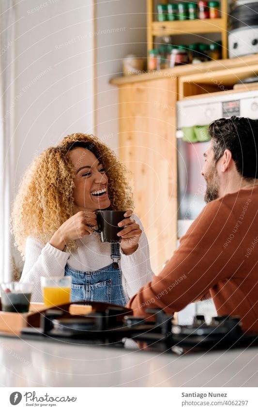 Couple having breakfast in kitchen. middle age couple love cooking home cozy caucasian relationship preparing female happy person stove woman beautiful girl