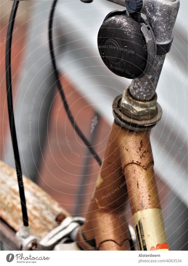 Close-up of a bicycle bell covered with black patina on a tarnished handlebar on a rusted bicycle Bicycle Bell Handlebars corroded rusty Old Retro turned off