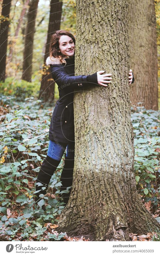 young woman hugging a tree in the forest - nature lover Young woman Tree Embrace Tree trunk Forest Nature Experiencing nature Love of nature nature lovers