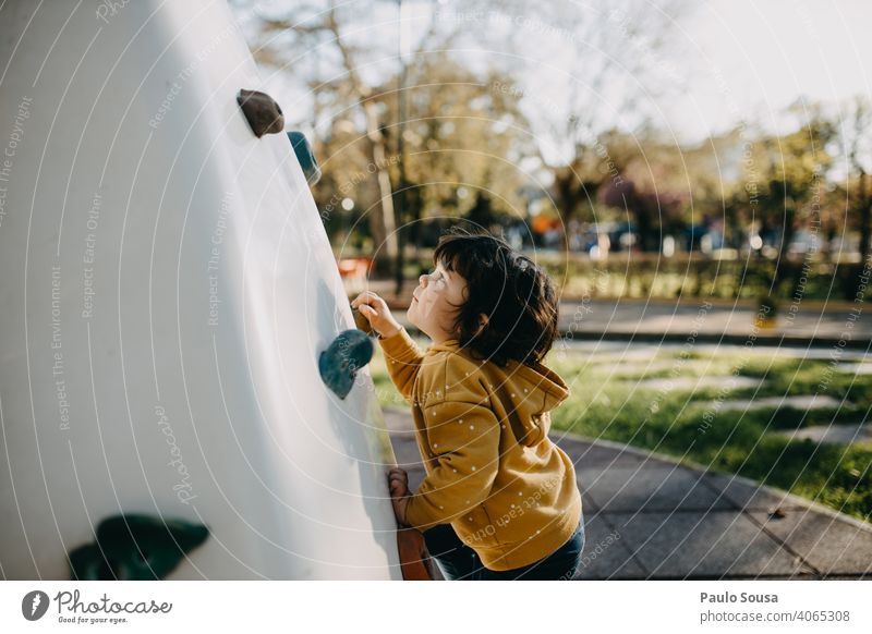 Child climbing wall at playground childhood Girl Caucasian 1 - 3 years Climbing Playing Playground Lifestyle Happiness Day Leisure and hobbies Exterior shot