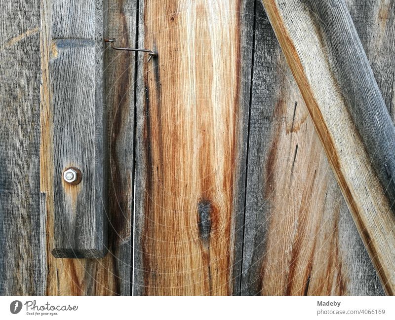 Untreated weathered wood with screw and nut of a wooden house in the Farmhouse Museum in Bielefeld Olderdissen in the Teutoburg Forest in East Westphalia-Lippe