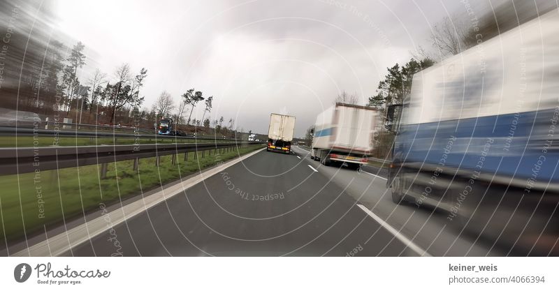Trucks block the passing lane on the two-lane highway Transport Road traffic Colour photo Motoring Traffic infrastructure Exterior shot Means of transport