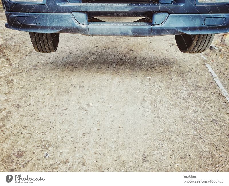 Withdrawn Aloof Traction Bumper Hover Tire Wheel Ground Exterior shot Colour photo Deserted lorry Driveway Detail