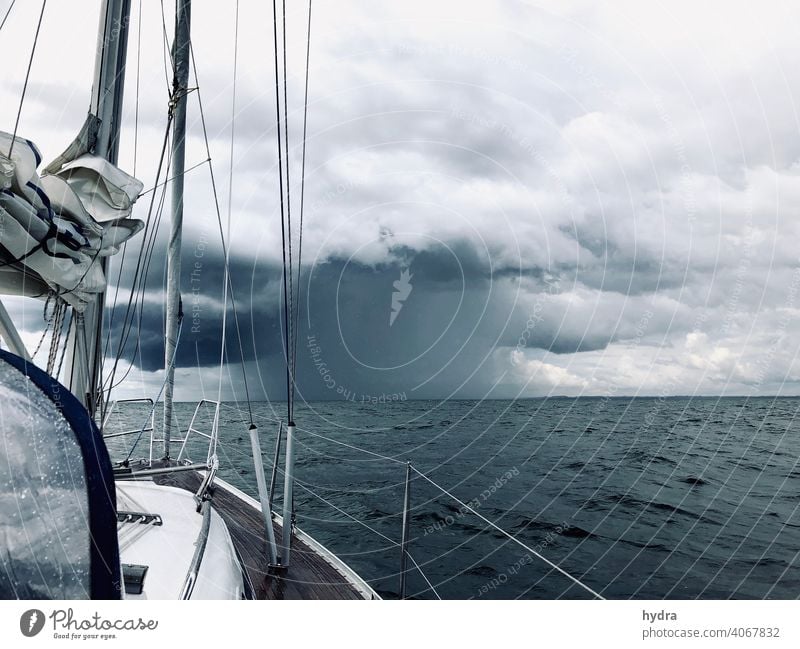 Sailing into a thunderstorm on the open sea - there is a lot of rain Sailboat yacht Yacht Ocean Baltic Sea Clouds downpour Storm clouds Thunder and lightning
