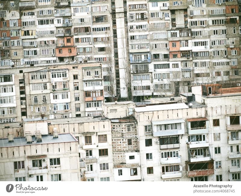 Tilted image of multistory residential buildings background. Blocks of flats built in Soviet era. aged apartment architecture balcony block city cityscape