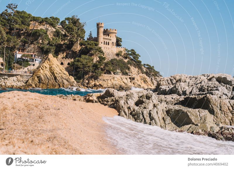 Mediterranean landscape on the Spanish costa brava of a beach with a medieval castle sea skyline nature water tourism relax environment calm vacation seascape