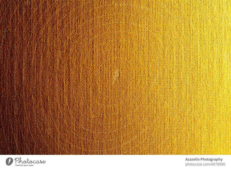 Gradiented canvas texture in yellow-orange - a Royalty Free Stock