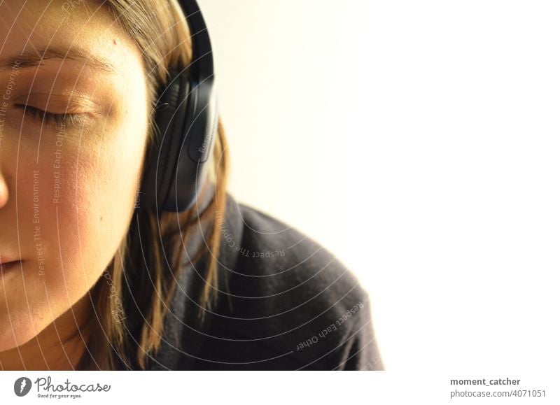 Woman listening to music with closed eyes and headphones Listen to music Headphones Music Listening Podcast audio book Closed eyes Concentrate concentrated