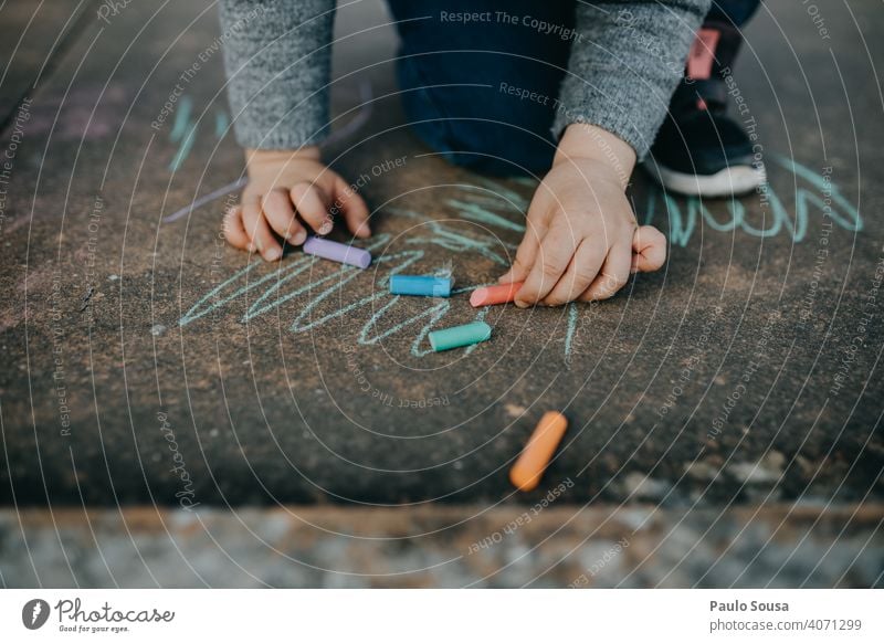Child drawing with colored chalk on the floor Draw Drawing Chalk Street painting Chalk drawing Playing Infancy Creativity Painting (action, artwork) Art