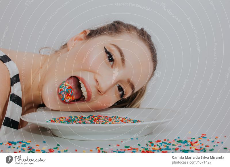 Woman with candy colorful confetti anniversary anxiety background beautiful birthday celebration copyspace creative decoration easter fashion fashionable