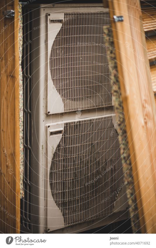 Air-source heat pump on a single-family house - clad in wood - open here | ecological, sustainable, modern and environmentally friendly heating system