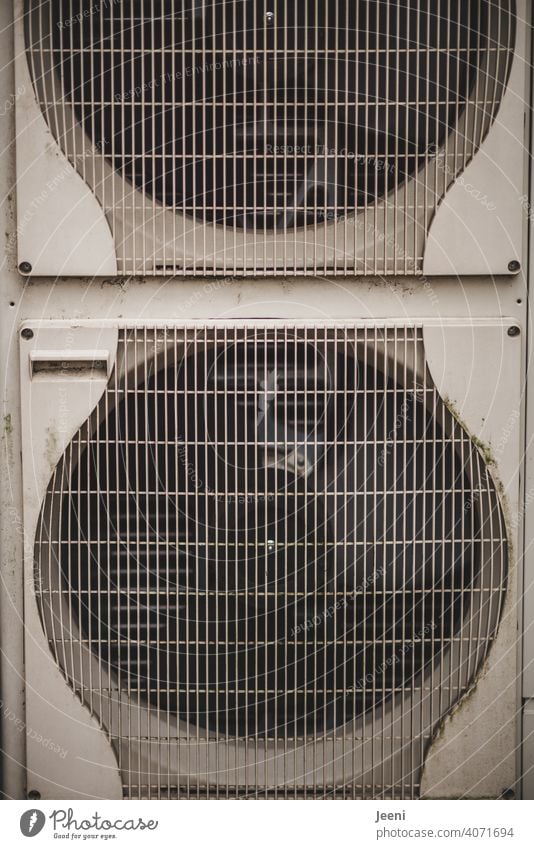 Fans of an air-source heat pump on a single-family house | ecological, sustainable, modern and environmentally friendly heating system Air source heat pump