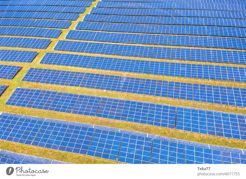a modern solar park from above solar cells sun sunny winter energy green energy sun energy clouds modern solar cells blue blue solar cells