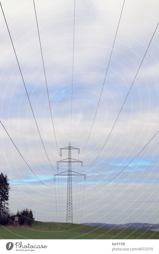 under high voltage lines with view to the power pole and into the landscape Electricity pylon Energy industry energy supply transport route Cables Overhead line