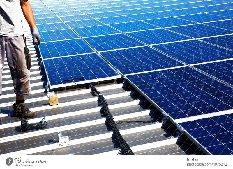 Installation of a photovoltaic system on a factory roof, PV system, solar technology Montage Roof mounting Factory roof photovoltaics Solar Power Solar Energy