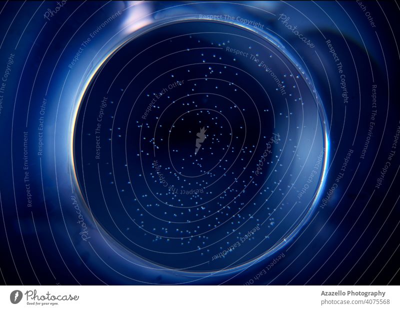 Abstract blue circle with tiny bubbles abstract abstract blue abstract round object art astral background black black background black minimalism blue hole blur