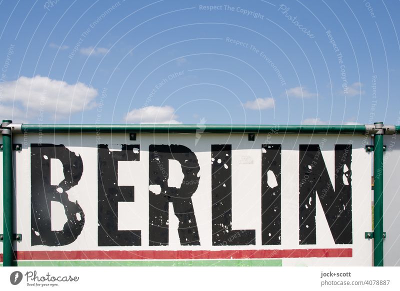 sexy sky over poor berlin Berlin Weathered Typography Signs and labeling Ravages of time Sportsground Gang Flaked off Word Frame Fence Sky cloudy Capital letter