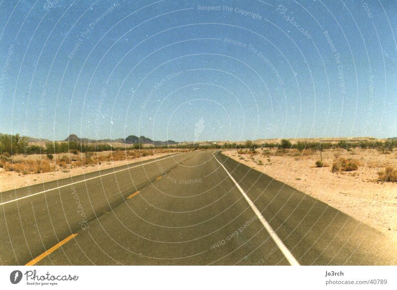 Open Road Far-off places Long Desert USA Central perspective Empty Deserted Blue sky Sky blue Cloudless sky Clear sky Horizon Right ahead Lane markings