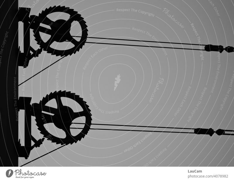 Cogwheels and overhead line of the Berlin tram Gearwheel Gears Overhead contact lines Overhead line stream Tram Abstract Technology Machinery Metal Mechanics