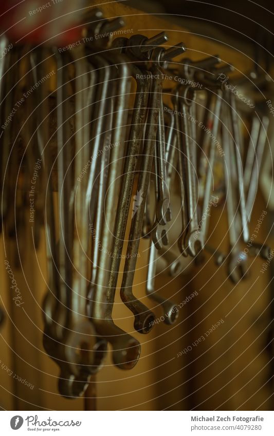 Old wrenches in a tool shed Equipment Wood Collection Tool Workshop DIY Repair work Construction job Wall (building) objects Interior Dirty Retro indoors