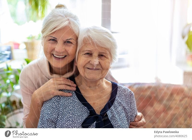 Senior woman spending quality time with her daughter smiling happy enjoying positivity vitality confidence people senior mature casual female Caucasian elderly