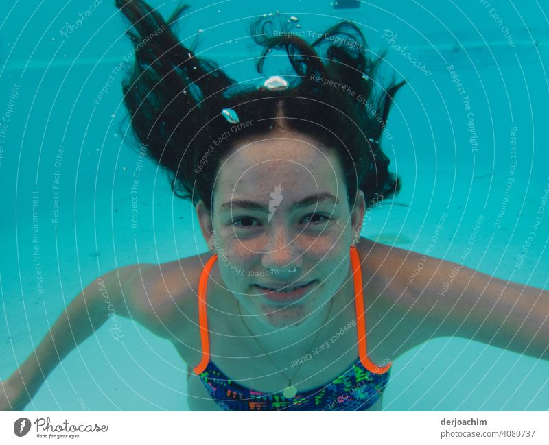Blub, blub . Laughing young girl with long black hair under water. Water Blue Relaxation Sky Summer Sun Nature Beautiful weather Colour photo Day