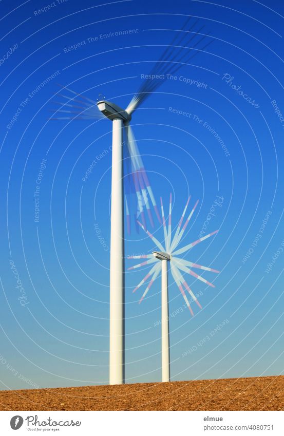 Two wind turbines - multiple exposure - on a field and in front of a blue, cloudless sky / alternative power generation / wind power Pinwheel Rotation Rotate