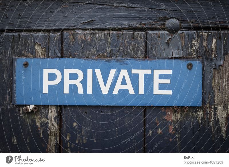 Sign on a weathered garden gate. private info Communication Private message sign board door Wall (barrier) writing authorized unauthorized Blue blue boards