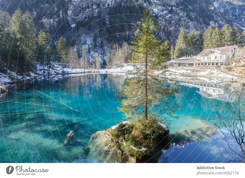 Tranquil blue lake in snowy mountains resort switzerland landscape nature azure water travel forest winter valley scenic tourism peace serene tranquil calm