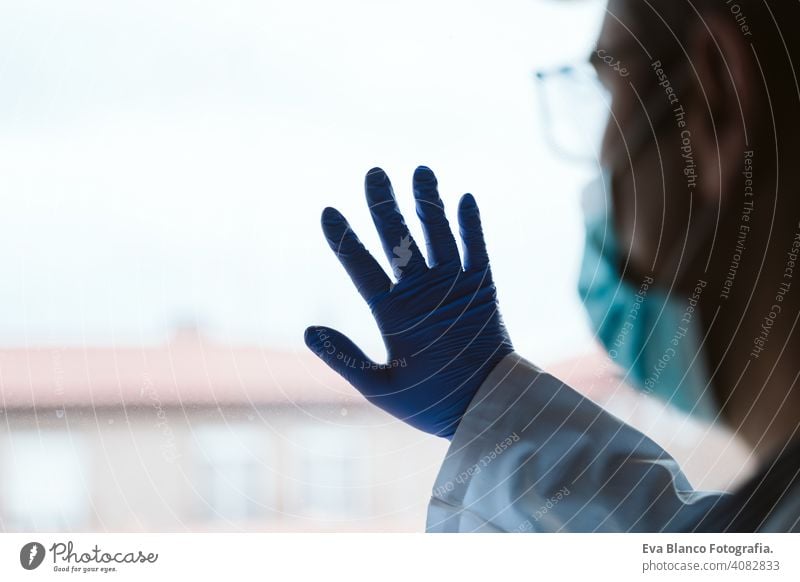 doctor man wearing protective mask , stethoscope and gloves indoors. Corona virus concept portrait professional corona virus hospital working infection safety