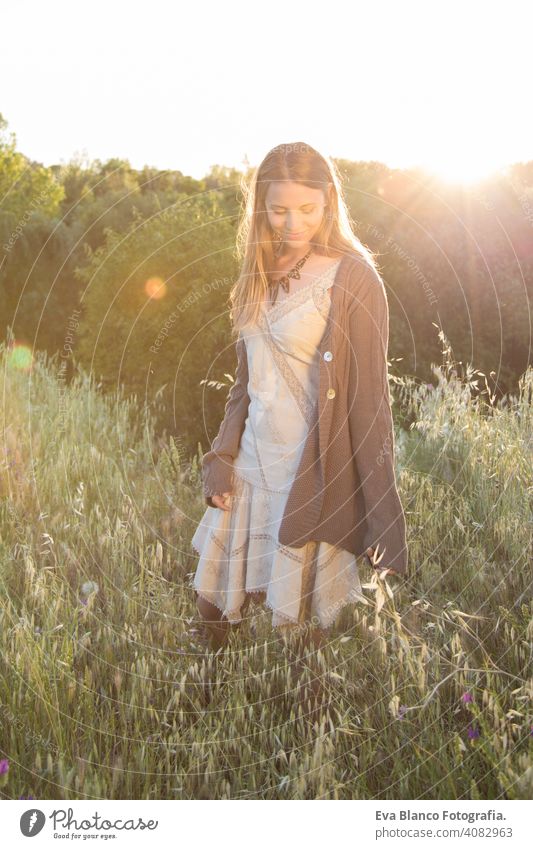 outdoors portrait of a beautiful young woman at sunset Portrait happy blonde blue eyes bridge summer sunny hair happiness lifestyle face fun white person sexy