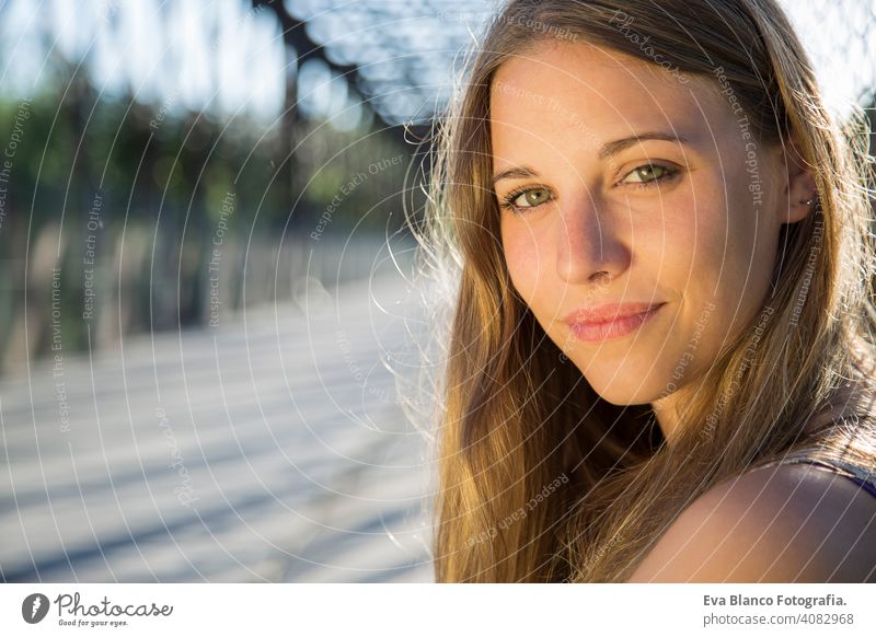 outdoors portrait of a beautiful young woman Portrait happy blonde blue eyes bridge summer sunny hair happiness lifestyle face fun white person sunset sexy