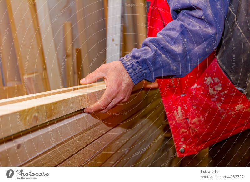 Carpenter lines up the glued wooden profiles in carpentry, preparing them for clamping Adhesive Align Apply Arrange Board Carpentry Collection Concept