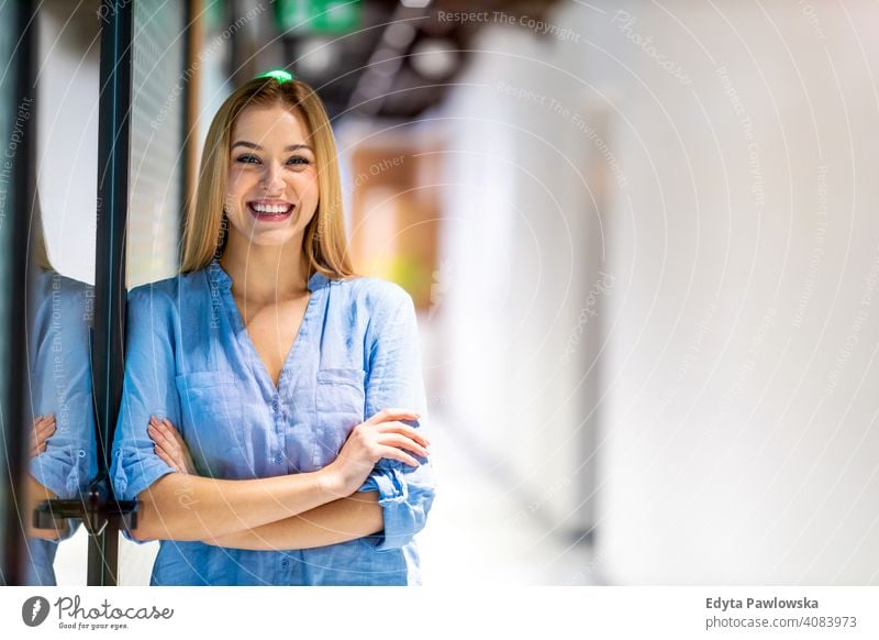 Portrait of confident young businesswoman standing in office girl people Entrepreneur successful professional adult female lifestyle indoors millennial