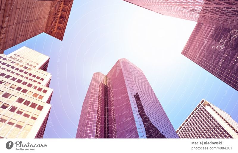 Looking up at Manhattan skyscrapers, color toned picture, New York City, USA. city office building business pink purple blue look up NYC wall filtered