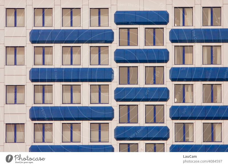 Blue and white facade of a hotel with many windows in Prenzlauer Berg Window Facade Cladding Building Hotel Hotel room White blue-white Exterior shot