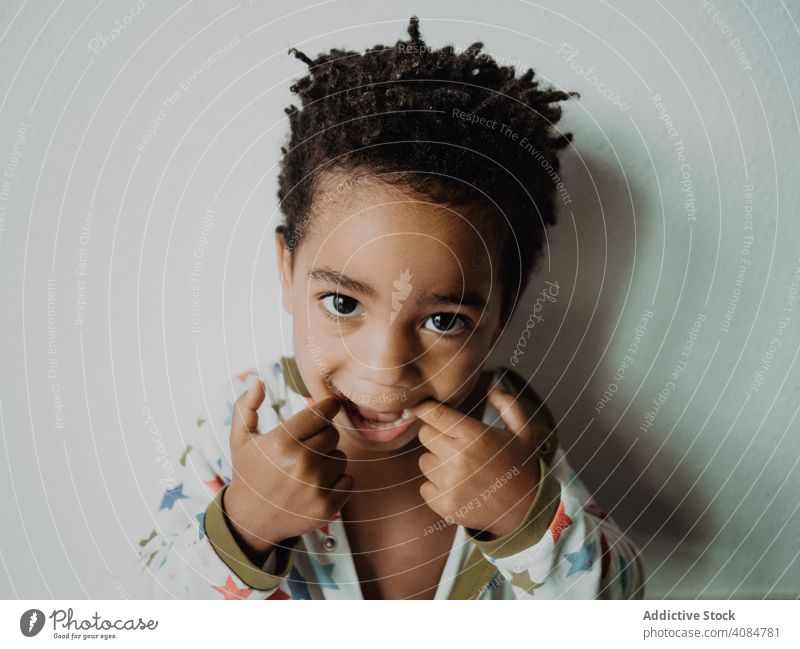 Black child grimacing for camera boy grimace funny african american pajamas face expression little joy kid cheerful happy cute adorable sweet lovely charming
