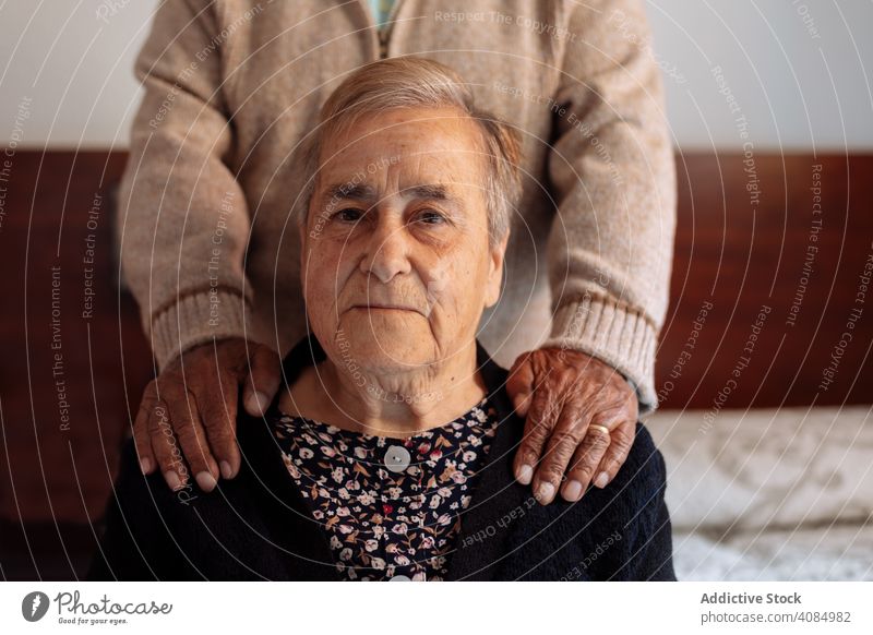 Elderly couple in interior of their house elderly senior old portrait sad mature family female caucasian aged retirement alzheimer people woman lifestyle