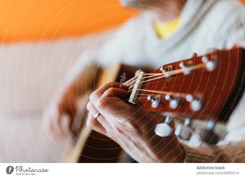 Detail of a man playing the guitar musician acoustic closeup instrument old detail hand player musical string concert chord classic guitarist electric finger