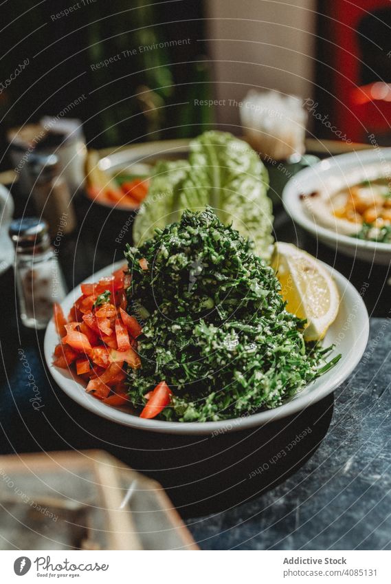 tabule salad in a bowl cucumber eating food grain lunch fresh culture gastronomy quinoa appetizer onion plate delicious arabic herb tabouleh dinner colorful