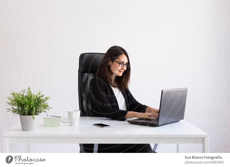 beautiful young Business woman using his laptop  in the office. Business Concept.white backgrounds computer worker businesswoman mobile smart phone tablet plant