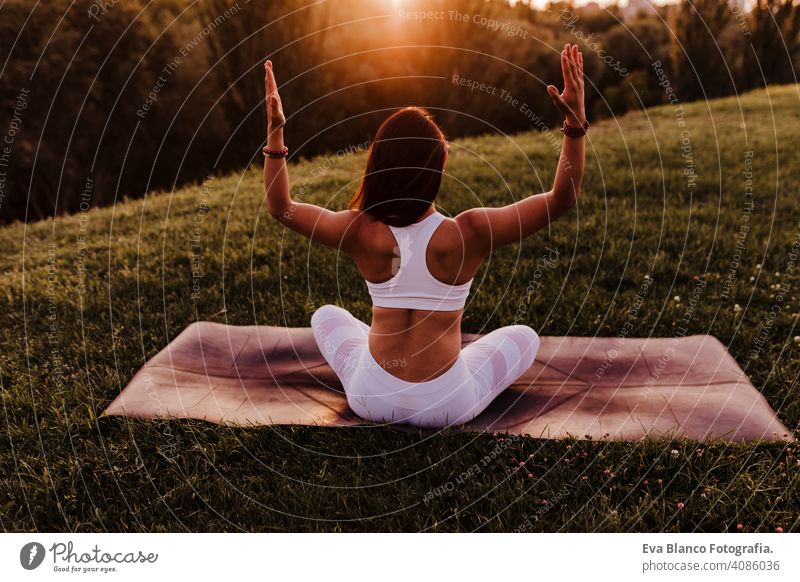 Pretty woman doing yoga exercises in the park. - a Royalty Free Stock Photo  from Photocase
