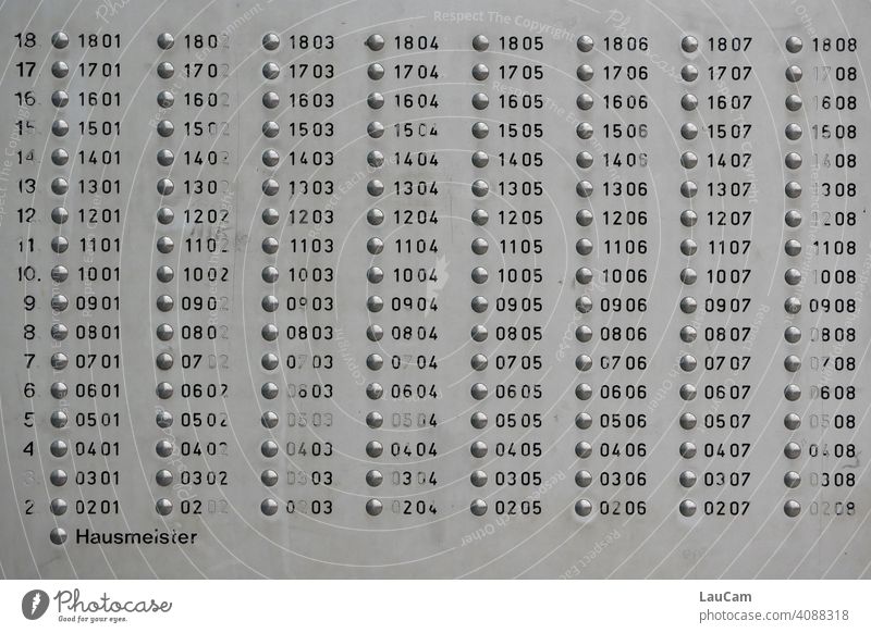 Numbered bell buttons plus caretaker's bell in a high-rise building in Berlin-Marzahn Bell buttons bell shield Janitor High-rise Prefab construction Numbers