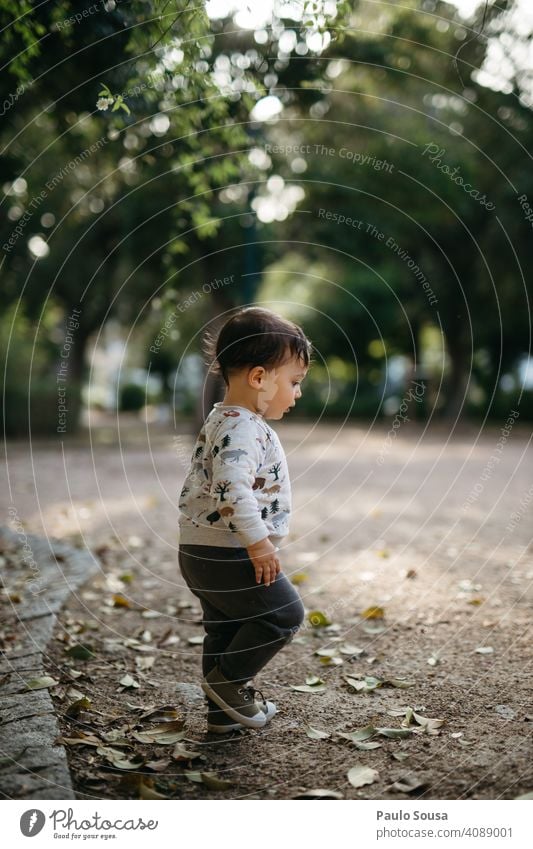 Child walking in the park childhood side view Park Authentic Childhood memory Multicoloured Day 1 - 3 years Joy Caucasian Infancy Exterior shot Colour photo