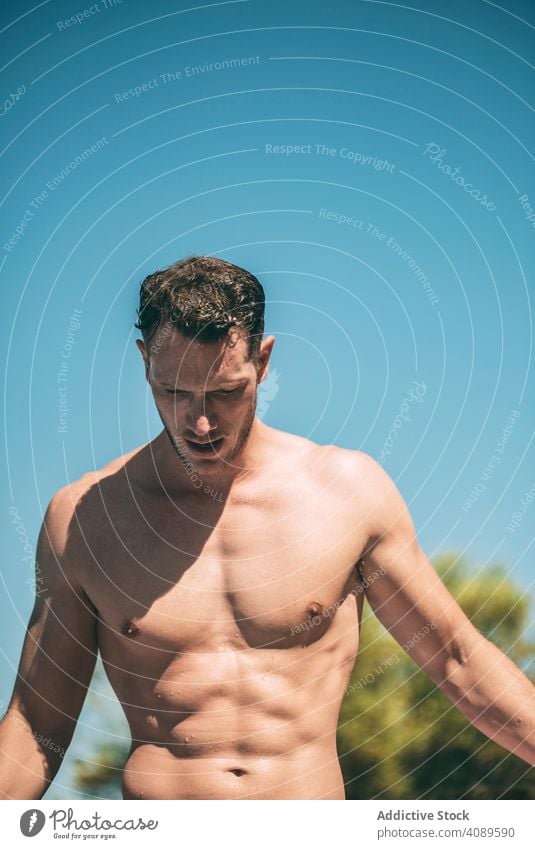 Handsome muscular man in sunny day shirtless wet hair male athletic young body person lifestyle handsome sport fit summer healthy fitness guy attractive