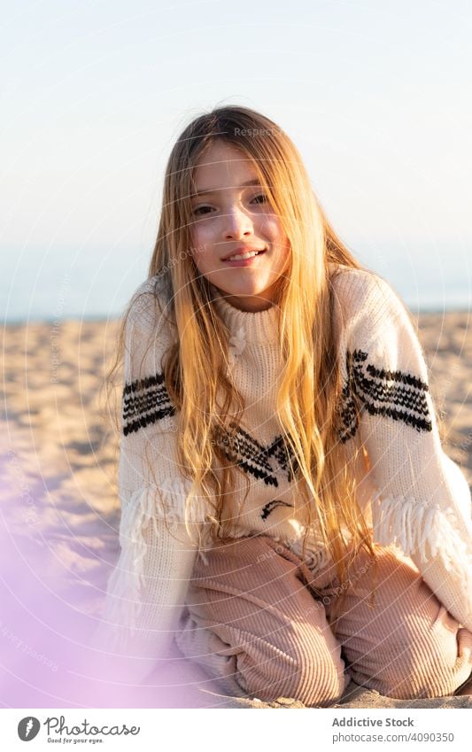 Teen girl looking at camera on beach teen looking through smiling curious piece transparent sweater teenager rest relax lifestyle leisure paint face cute