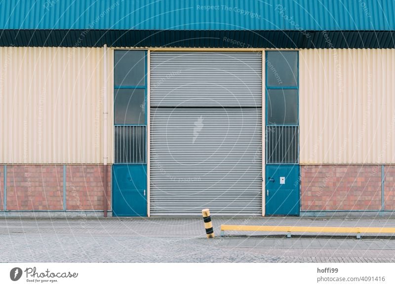 dreary view of a warehouse with approached boundary pile Warehouse Harbour Storage Facade Depot Wall (building) Industrial plant Factory Architecture Trade