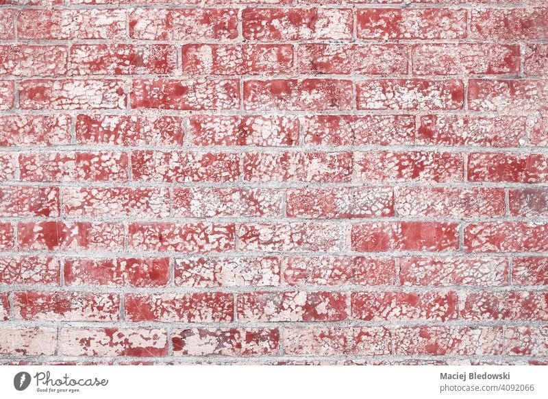 Old red brick wall grunge textured background or wallpaper. old pattern peel dirty photo aged paint retro